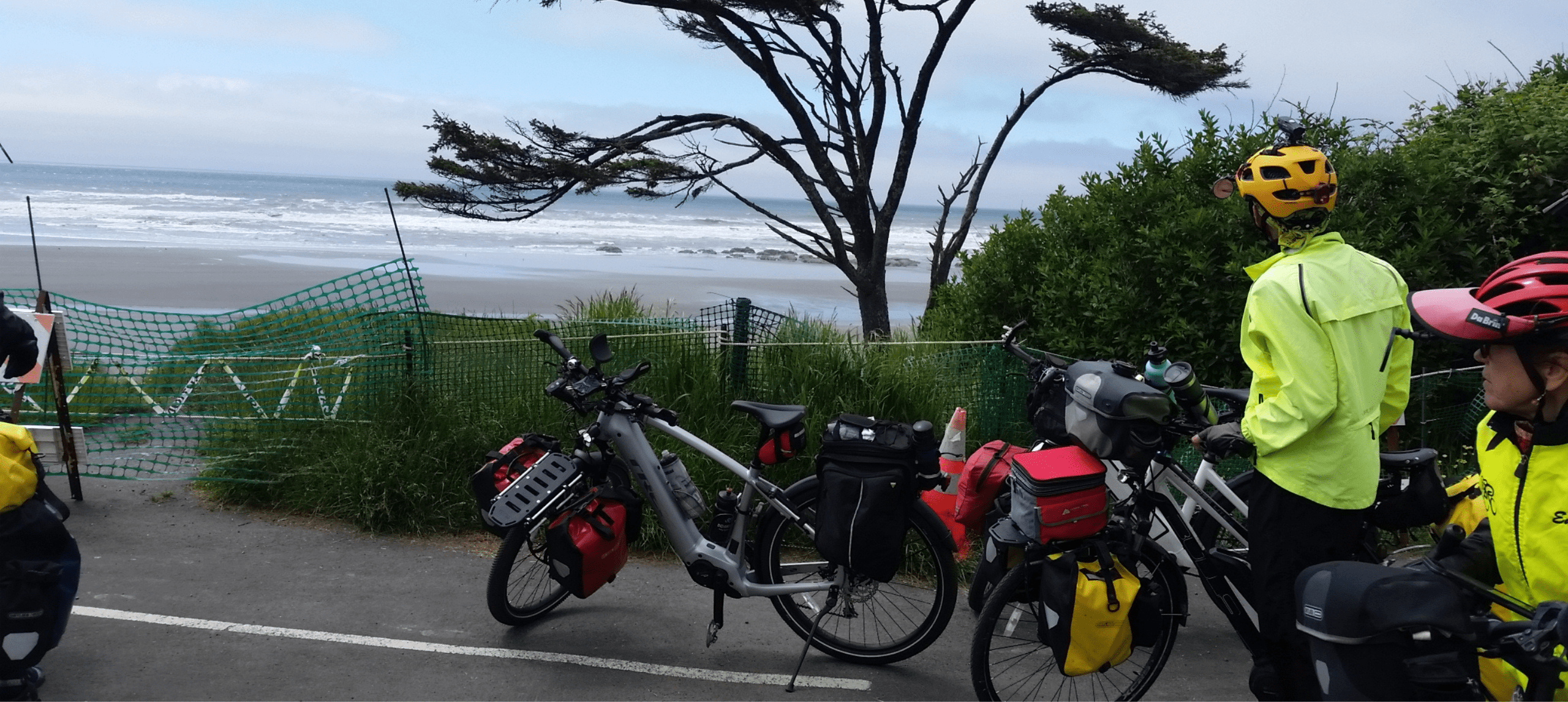 Touring bicycles and cyclists by seaside