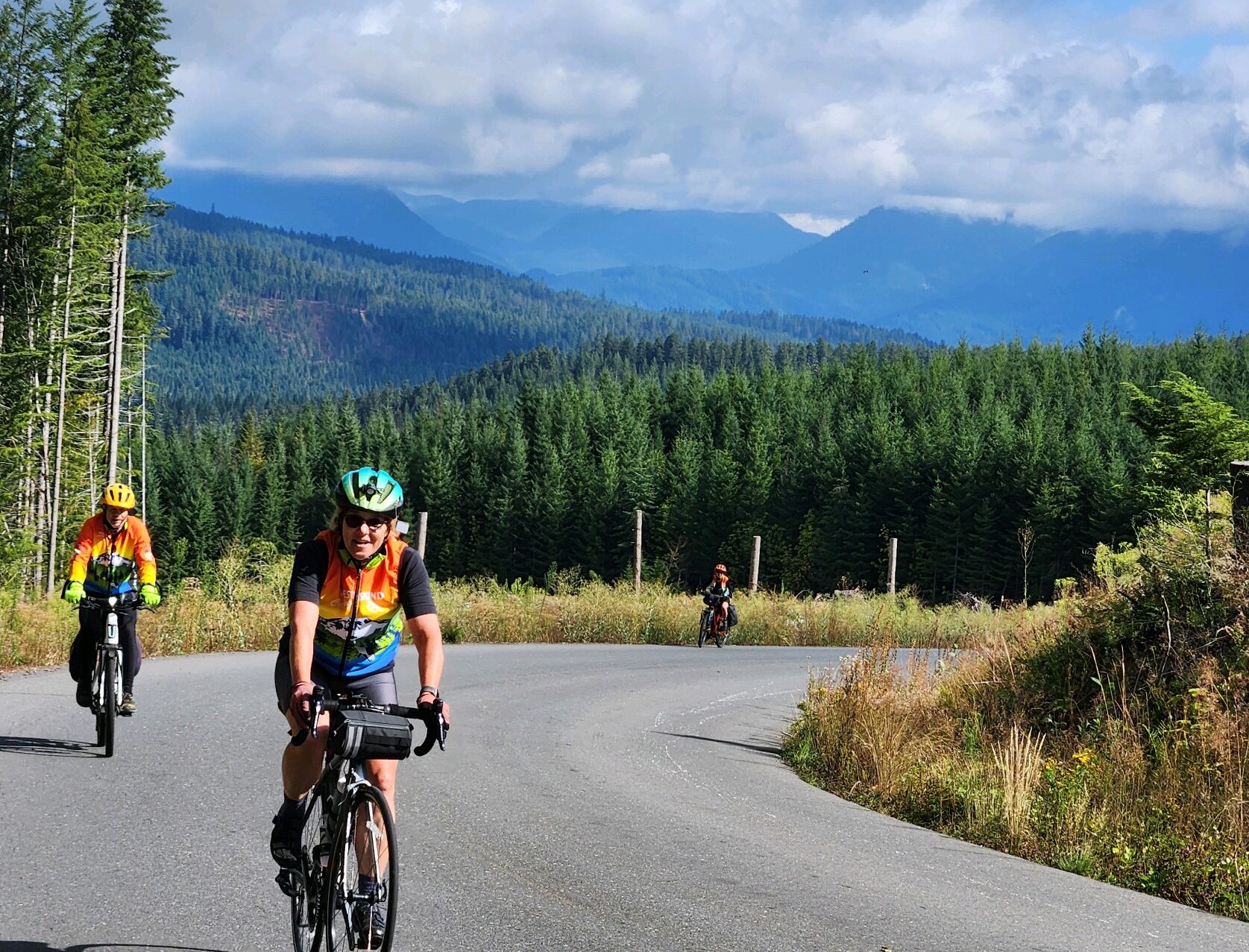 Cyclists riding on winding mountain road