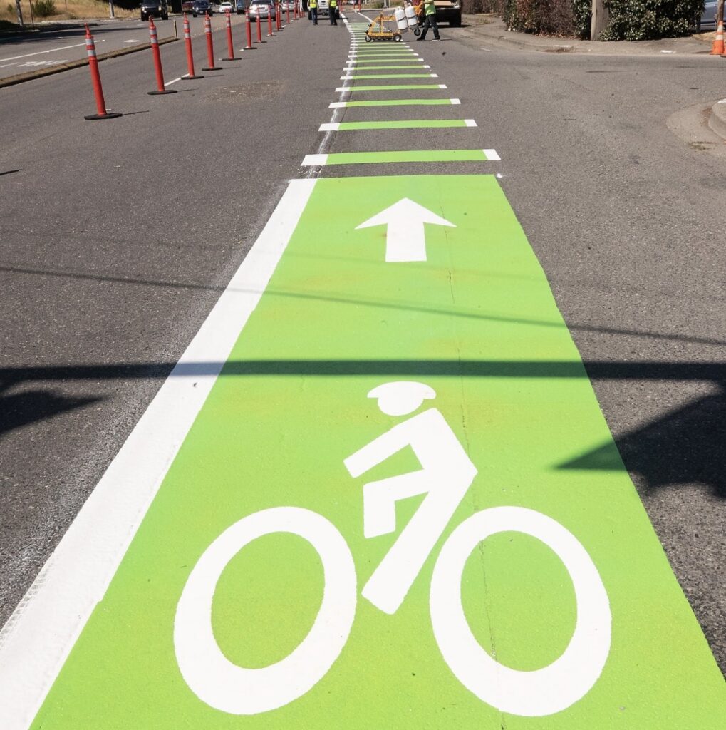 Green bike lane with white bicycle symbol