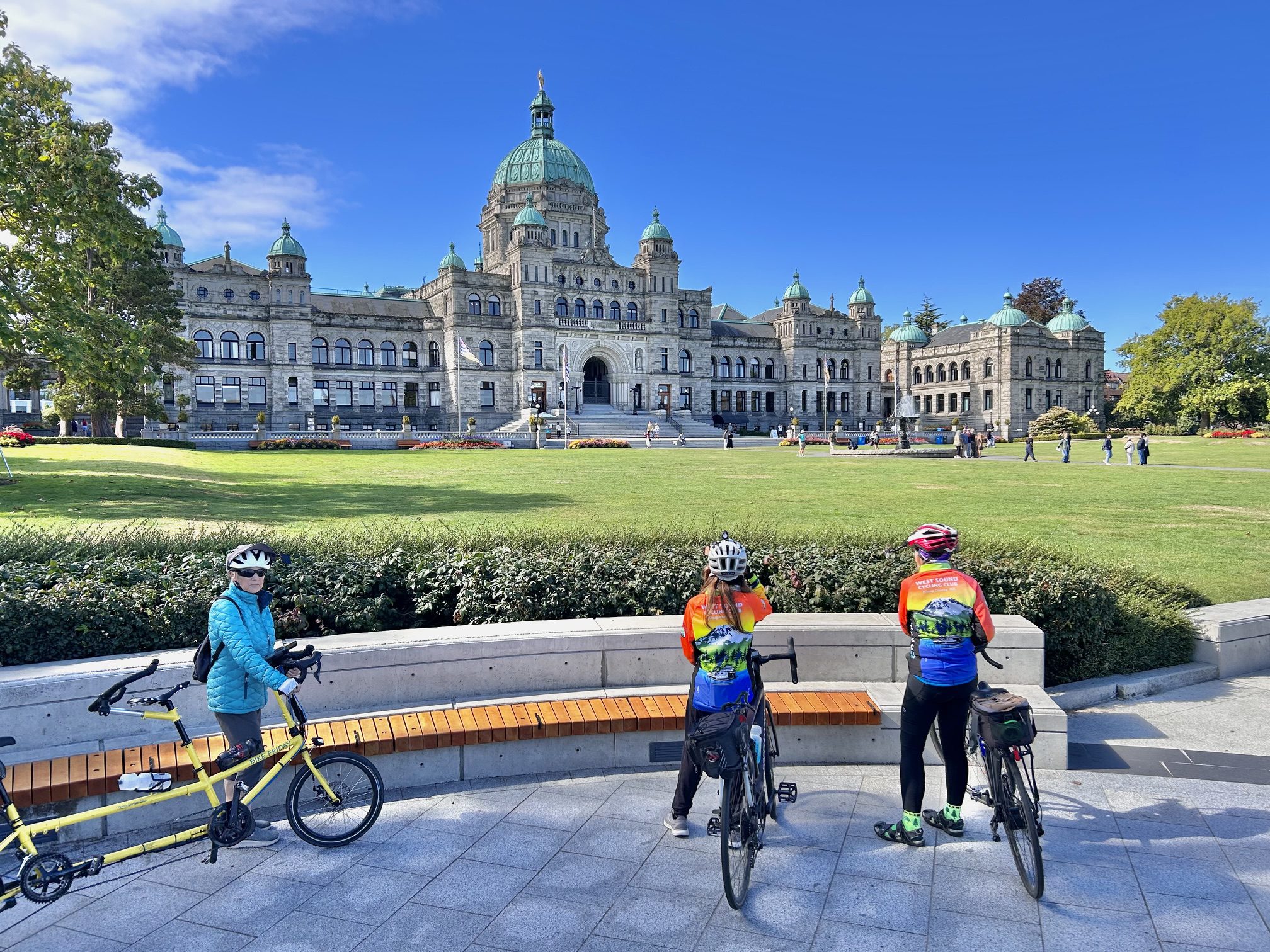 Cyclists in front of domed parliament building